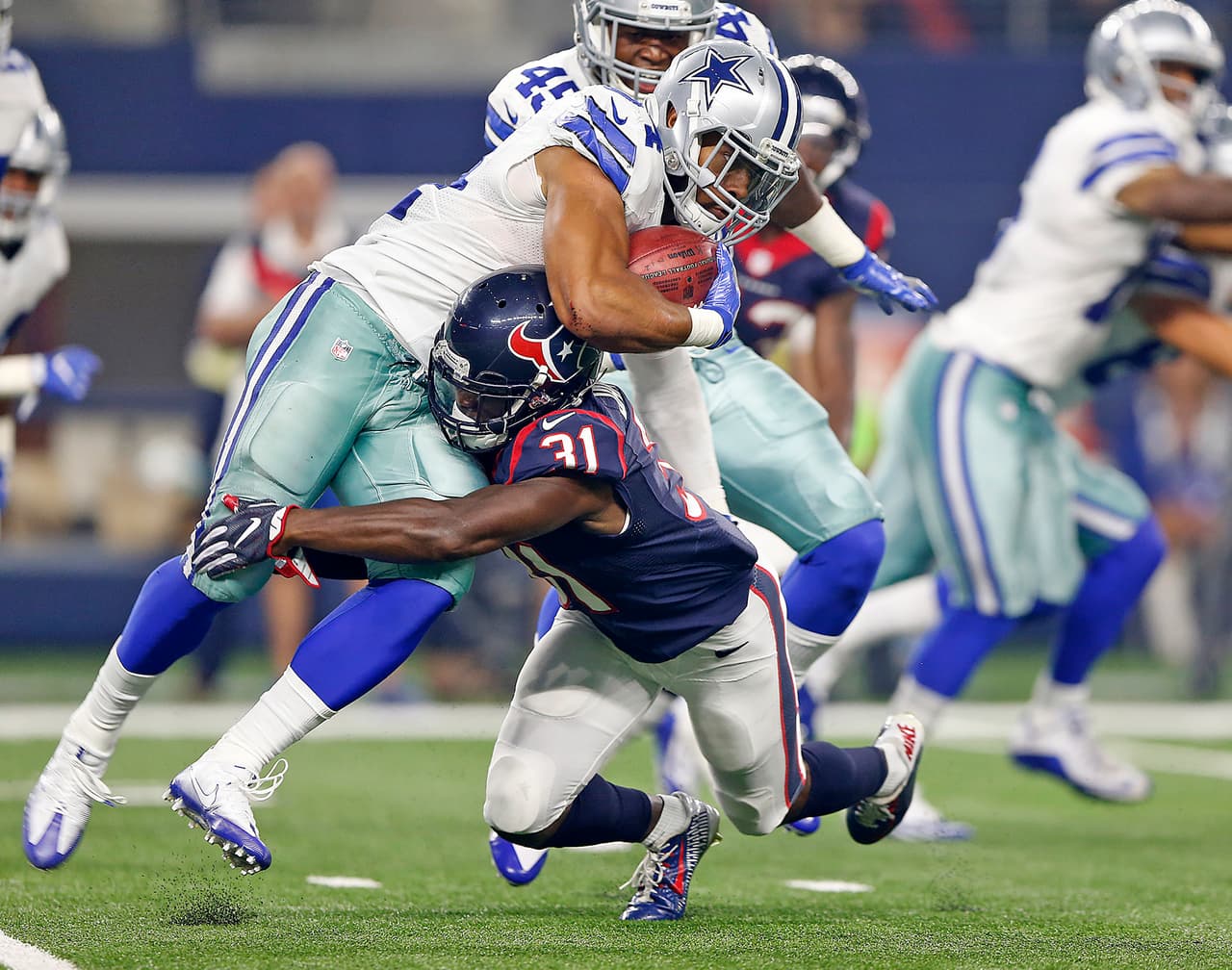 Dallas Cowboys running back Darius Jackson (34) is tackled by Houston Texans cornerback Charles James (31) while returning a kickoff during a preseason NFL game, Thursday, September 1, 2016, in Arlington, Texas. The Texans defeated the Cowboys, 28-17. (James D. Smith via AP)