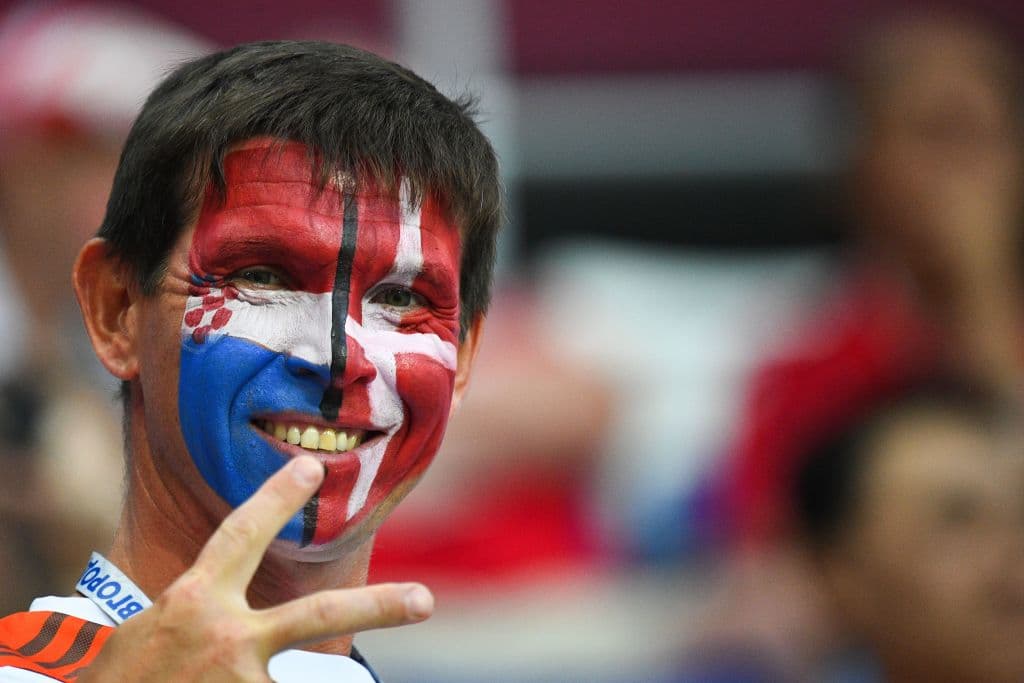 A football fan has his face painted with the flags of Croatia and Denmark before the Russia 2018 World Cup round of 16 football match between Croatia and Denmark at the Nizhny Novgorod Stadium in Nizhny Novgorod on July 1, 2018. (Photo by Johannes EISELE / AFP) / RESTRICTED TO EDITORIAL USE - NO MOBILE PUSH ALERTS/DOWNLOADS (Photo credit should read JOHANNES EISELE/AFP/Getty Images)