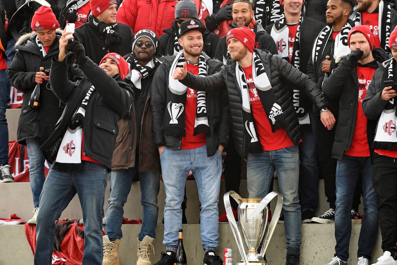 Dec 11, 2017; Toronto, Ontario, Canada; Toronto FC defender Stephen Beitashour (33) takes a selfie with the team during the Toronto FC MLS Championship parade at City Hall Square. Mandatory Credit: Gerry Angus-USA TODAY Sports