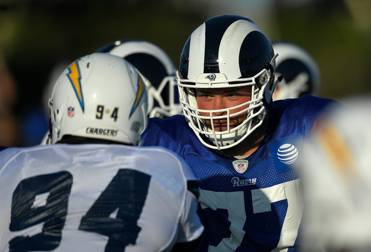 Los Angeles Chargers defensive end Corey Liuget, left, and Los Angeles Rams offensive tackle Andrew Whitworth face off during joint NFL football practice, Wednesday, Aug. 9, 2017, in Irvine, Calif. (AP Photo/Mark J. Terrill)