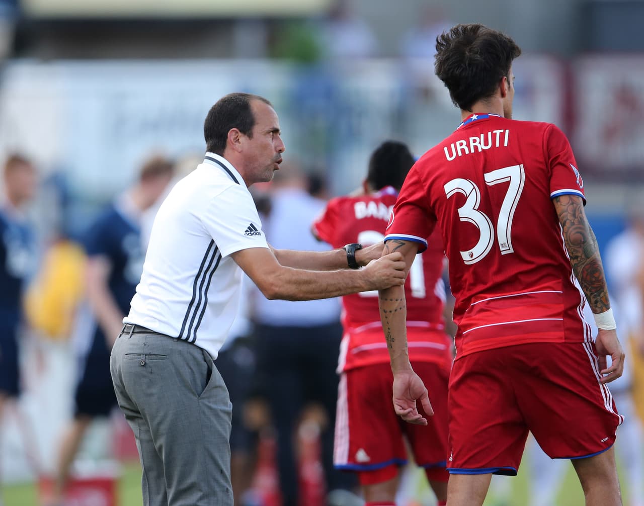 Jul 31, 2016; Dallas, TX, USA; FC Dallas head coach Oscar Pareja instructs forward Maximiliano Urruti (37) during the game against the Vancouver Whitecaps at Toyota Stadium. Mandatory Credit: Matthew Emmons-USA TODAY Sports