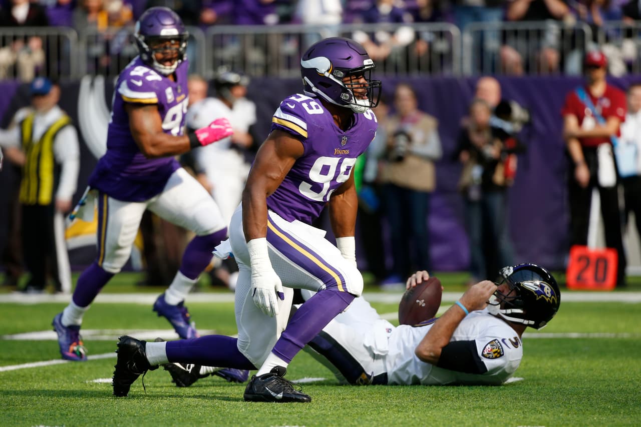 Minnesota Vikings defensive end Danielle Hunter (99) celebrates after sacking Baltimore Ravens quarterback Joe Flacco, right, during the first half of an NFL football game, Sunday, Oct. 22, 2017, in Minneapolis. (AP Photo/Bruce Kluckhohn)