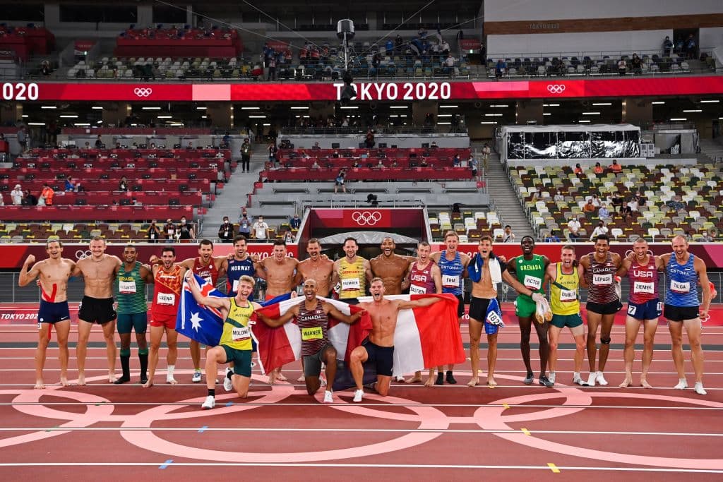 Athletes, including winner Canada's Damian Warner, silver medallist France's Kevin Mayer and bronze medallist Australia's Ashley Moloney, pose after the men's decathlon during the Tokyo 2020 Olympic Games at the Olympic Stadium in Tokyo on August 5, 2021. (Photo by Andrej ISAKOVIC / AFP) (Photo by ANDREJ ISAKOVIC/AFP via Getty Images)