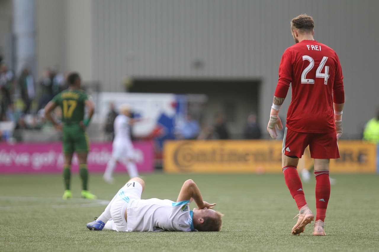 Nov 4, 2018; Portland, OR, USA; Seattle Sounders defender Chad Marshall (14) reacts after being injured in the first half against the Portland Timbers at Providence Park. Mandatory Credit: Jaime Valdez-USA TODAY Sports