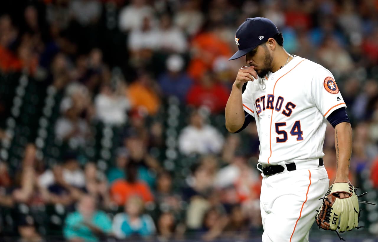 Houston Astros relief pitcher Roberto Osuna walks toward the dugout after pitching against the Seattle Mariners during the ninth inning of a baseball game Thursday, Aug. 9, 2018, in Houston. (AP Photo/David J. Phillip)