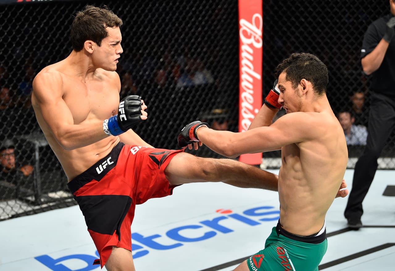 MEXICO CITY, MEXICO - AUGUST 05: (L-R) Humberto Bandenay of Peru kicks Martin Bravo of Mexico in their lightweight bout during the UFC Fight Night event at Arena Ciudad de Mexico on August 5, 2017 in Mexico City, Mexico. (Photo by Jeff Bottari/Zuffa LLC/Zuffa LLC via Getty Images)