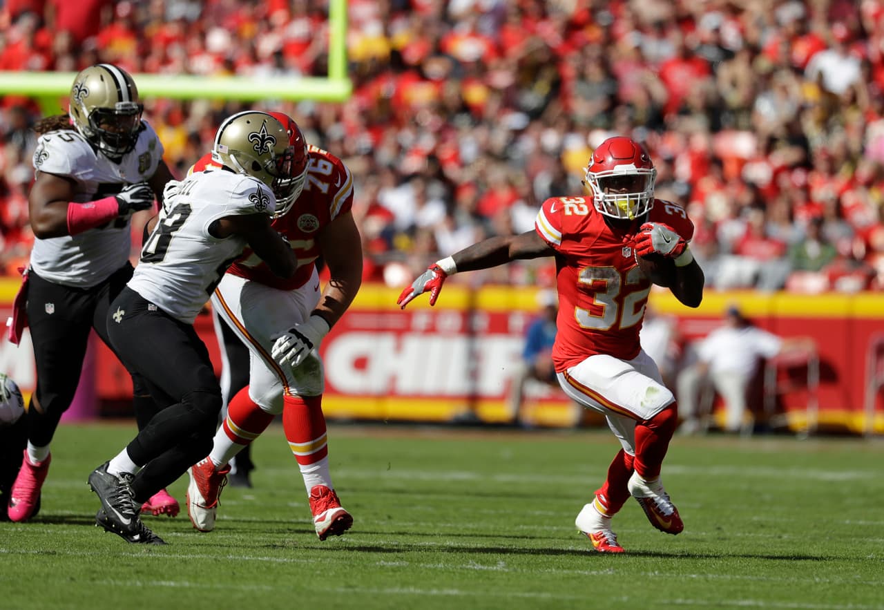 Kansas City Chiefs running back Spencer Ware (32) carries the ball during the first half of an NFL football game against the New Orleans Saints in Kansas City, Mo., Sunday, Oct. 23, 2016. (AP Photo/Jeff Roberson)