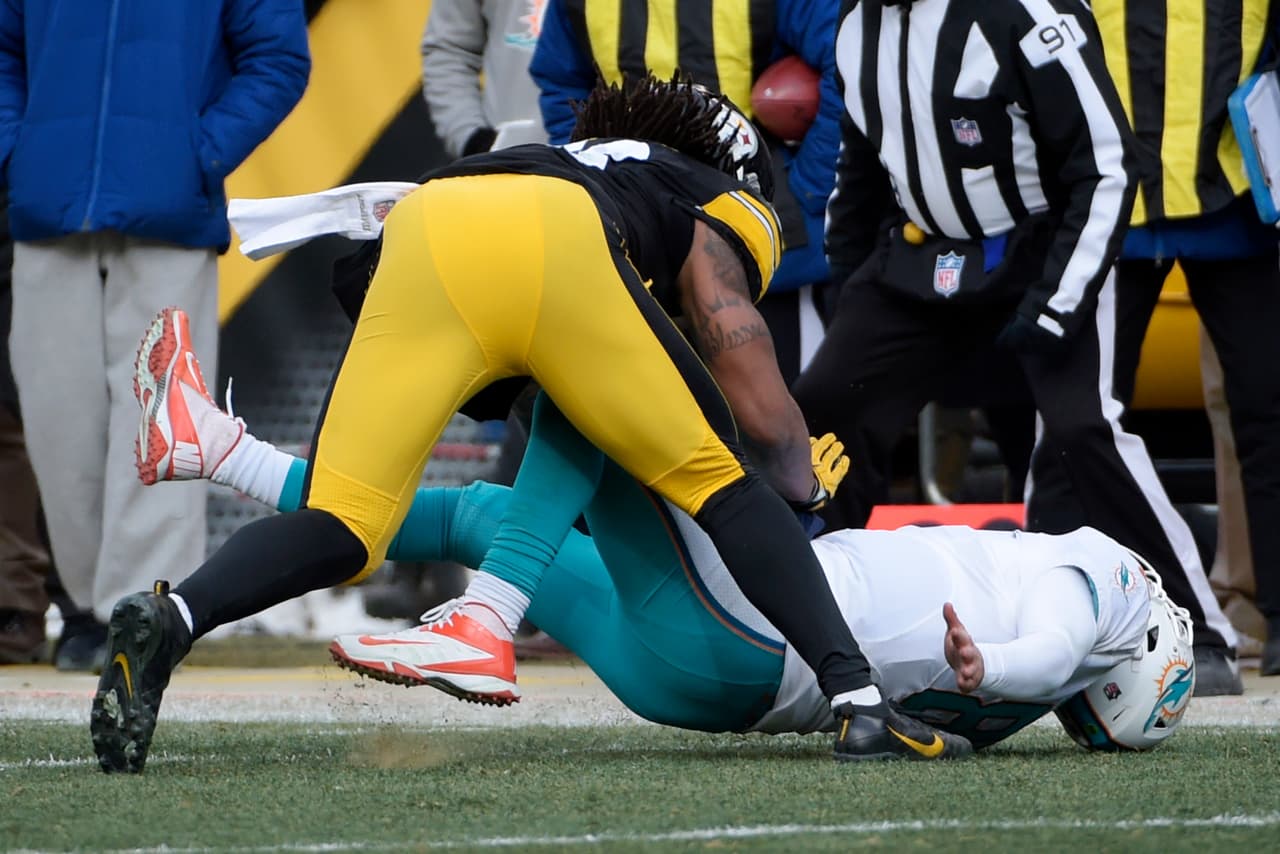 FILE - In this Jan. 8, 2017, file photo, Pittsburgh Steelers outside linebacker Bud Dupree (48) hits Miami Dolphins quarterback Matt Moore (8) during the first half of an AFC Wild Card NFL football game in Pittsburgh. There are still gaps in the NFL concussion protocol - what happened with Moore in the playoffs, for example - and it is never good when teams are forced to start backup quarterbacks in the postseason because of injuries to others. (AP Photo/Fred Vuich, File)