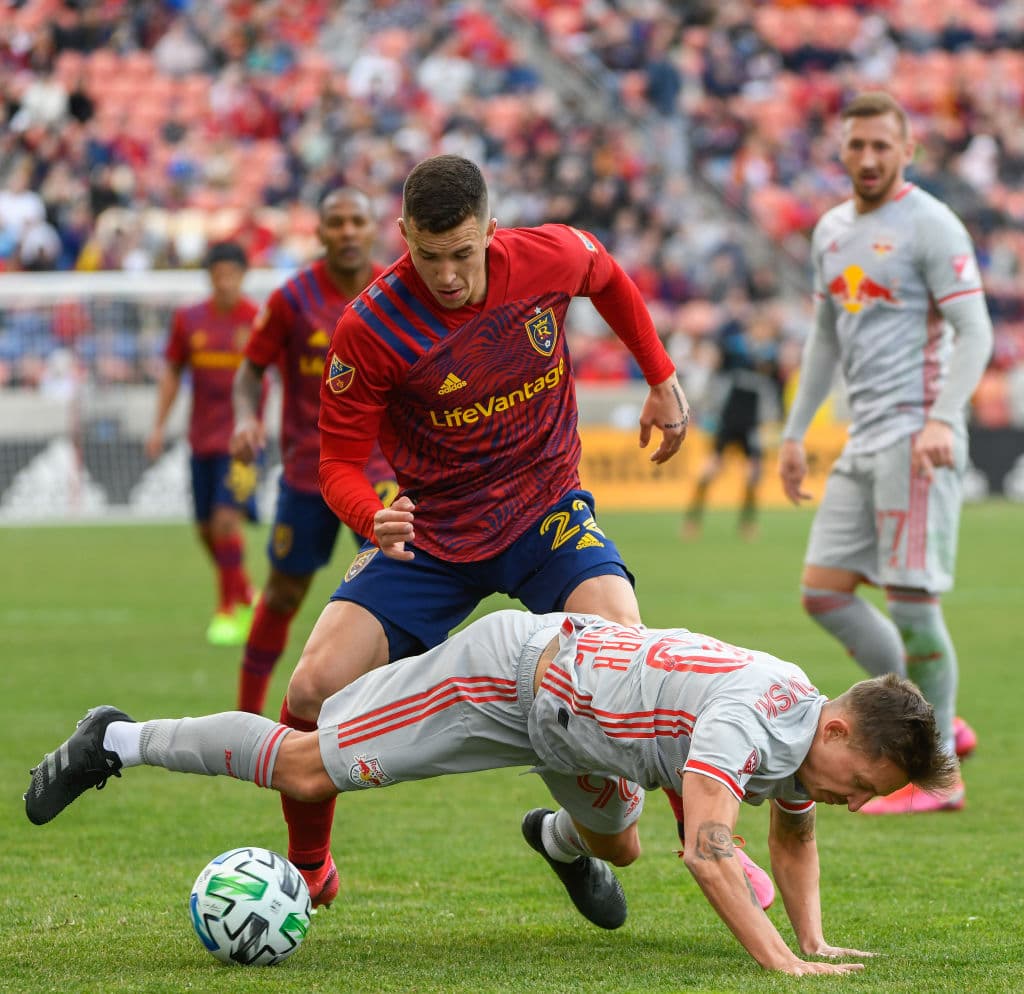 SANDY, UT - MARCH 07: Aaron Herrera #22 of Real Salt Lake fights for the ball with Marc Rzatkowski #90 of New York Red Bulls during a game at Rio Tinto Stadium on March 7, 2020 in Sandy, Utah. (Photo by Alex Goodlett/Getty Images)