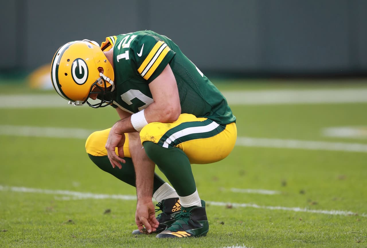 Green Bay Packers quarterback Aaron Rodgers (12) kneels against the Seattle Seahawks during an NFL football game on Sunday, Sept. 10, 2017, in Green Bay, Wis. (Jeff Haynes/AP Images for Panini)