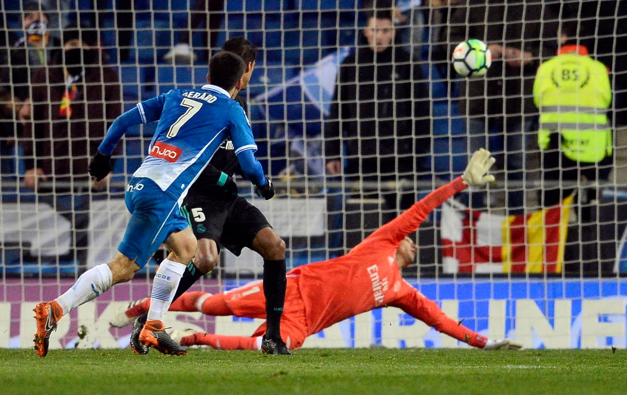 Espanyol's Spanish forward Gerard Moreno (L) shoots to score a goal during the Spanish league football match between RCD Espanyol and Real Madrid CF at the RCDE Stadium in Cornella de Llobregat on February 27, 2018. / AFP PHOTO / Josep LAGO (Photo credit should read JOSEP LAGO/AFP/Getty Images)