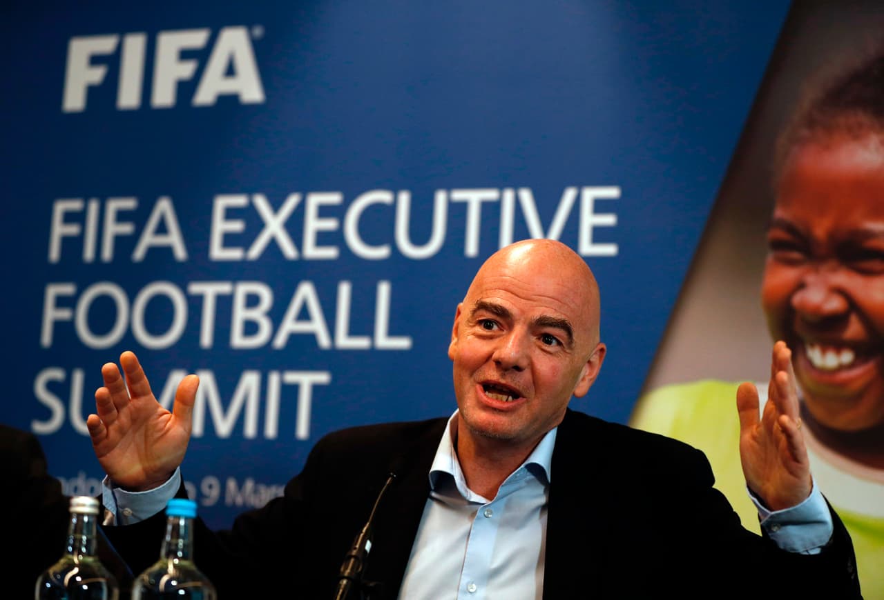 FIFA President Gianni Infantino gestures while talking with journalists during a press conference following the FIFA Executive Football Summit near Heathrow airport in London on March 9, 2017. Barcelona's extraordinary fightback to beat Paris Saint-Germain in the Champions League demonstrated football's unique capacity for surprise, FIFA president Gianni Infantino said. / AFP PHOTO / ADRIAN DENNIS (Photo credit should read ADRIAN DENNIS/AFP/Getty Images)