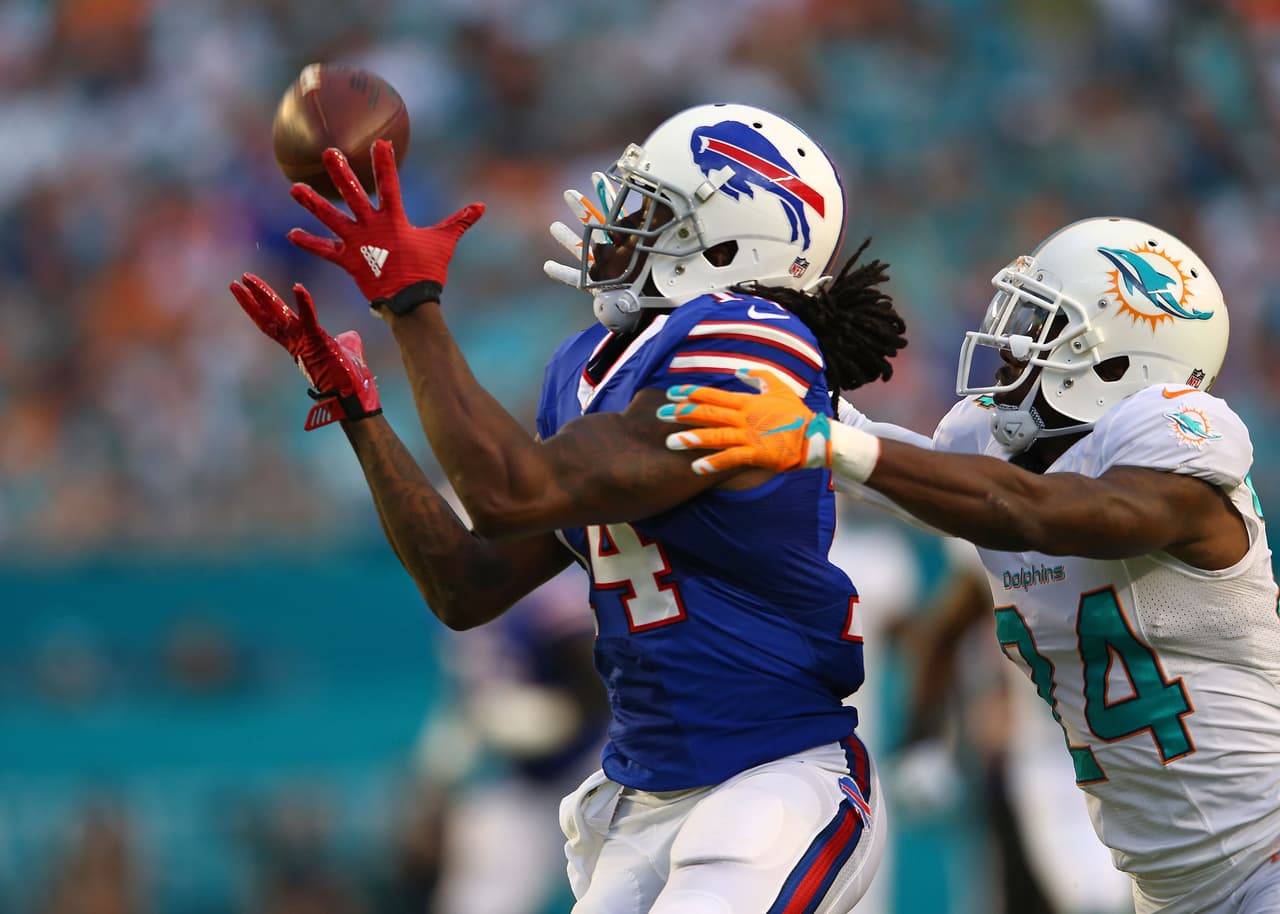 MIAMI GARDENS, FL - SEPTEMBER 27: Sammy Watkins #14 of the Buffalo Bills catches a pass past Brice McCain #24 of the Miami Dolphins during the first half of the game at Sun Life Stadium on September 27, 2015 in Miami Gardens, Florida. (Photo by Rob Foldy/Getty Images)