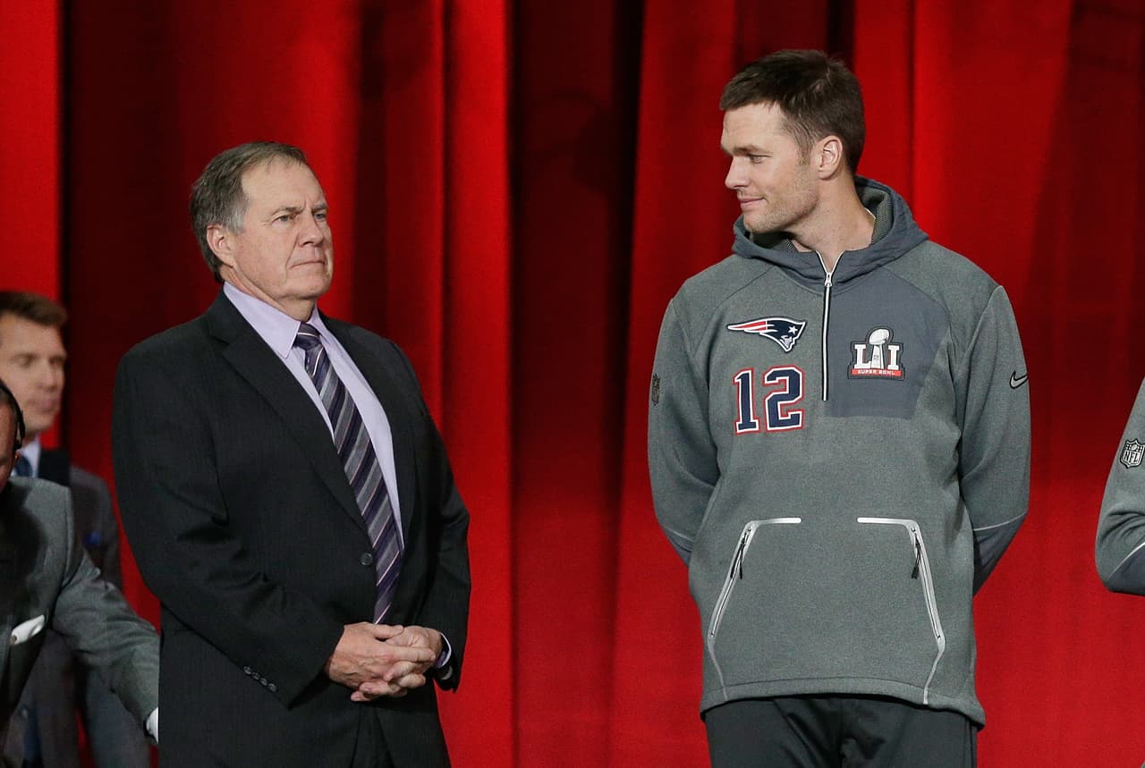 HOUSTON, TX - JANUARY 30: Head coach Bill Belichick of the New England Patriots and Tom Brady #12 stand onstage during Super Bowl 51 Opening Night at Minute Maid Park on January 30, 2017 in Houston, Texas. (Photo by Bob Levey/Getty Images)