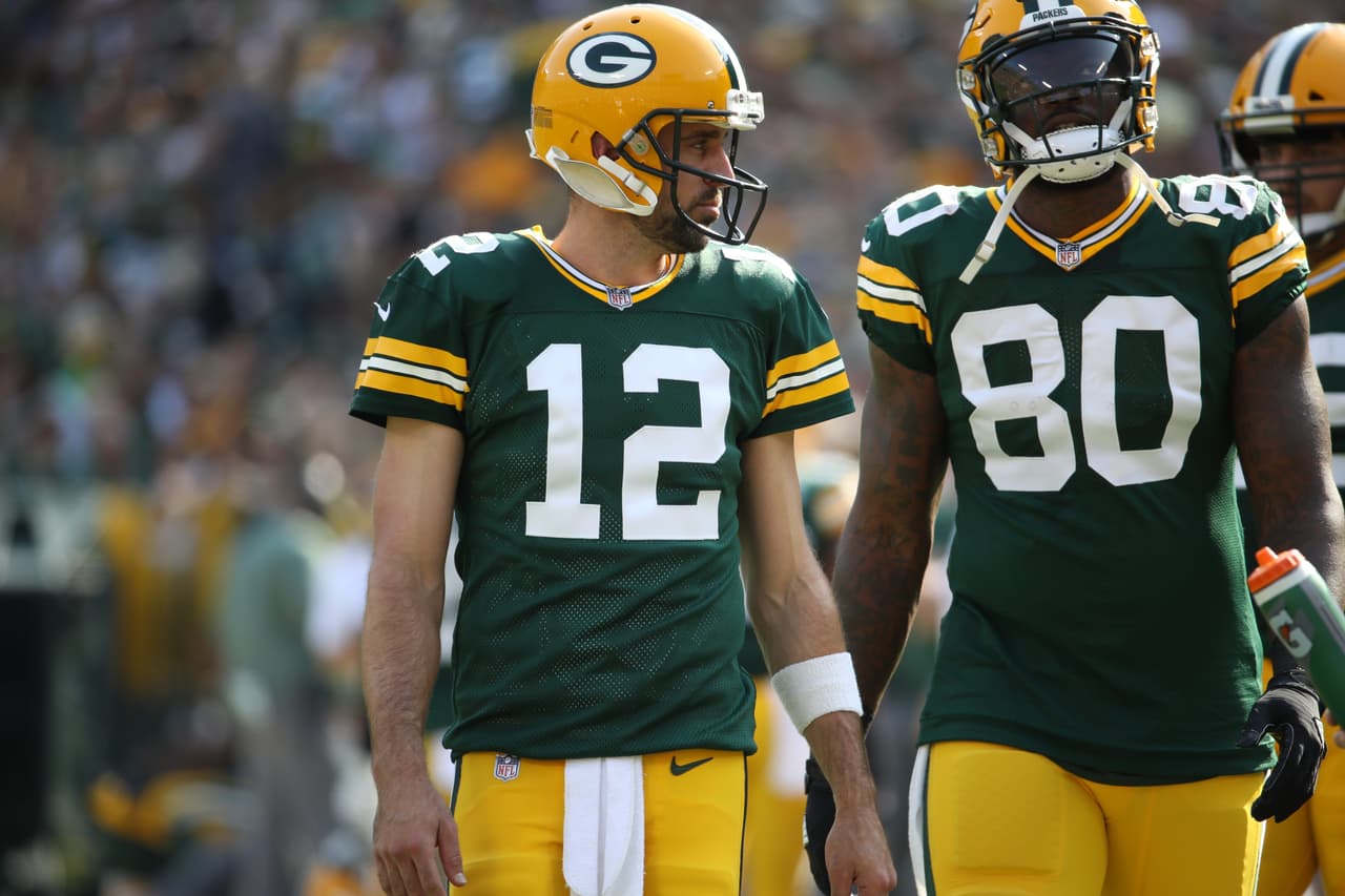 Green Bay Packers quarterback Aaron Rodgers (12) walks with Green Bay Packers tight end Martellus Bennett (80) during an NFL game between the Green Bay Packers and the Seattle Seahawks Sunday, Sept. 10, 2017, in Green Bay, Wis. (Tom Hauck via AP)