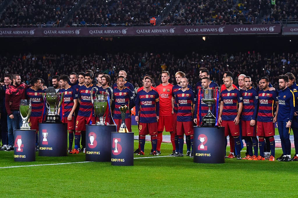 BARCELONA, SPAIN - DECEMBER 30: FC Barcelona players pose with La Liga, UEFA Champions League, Copa del Rey, UEFA Supercup and FIFA Club World Cup trophies prior to the La Liga match between FC Barcelona and Real Betis Balompie at Camp Nou on December 30, 2015 in Barcelona, Spain. (Photo by David Ramos/Getty Images)