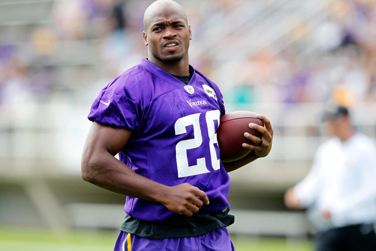 Minnesota Vikings running back Adrian Peterson (28) runs with the ball during the first day of NFL football training camp at Mankato State University in Mankato, Minn. on Friday, July, 29, 2016.(AP Photo/Andy Clayton-King)
