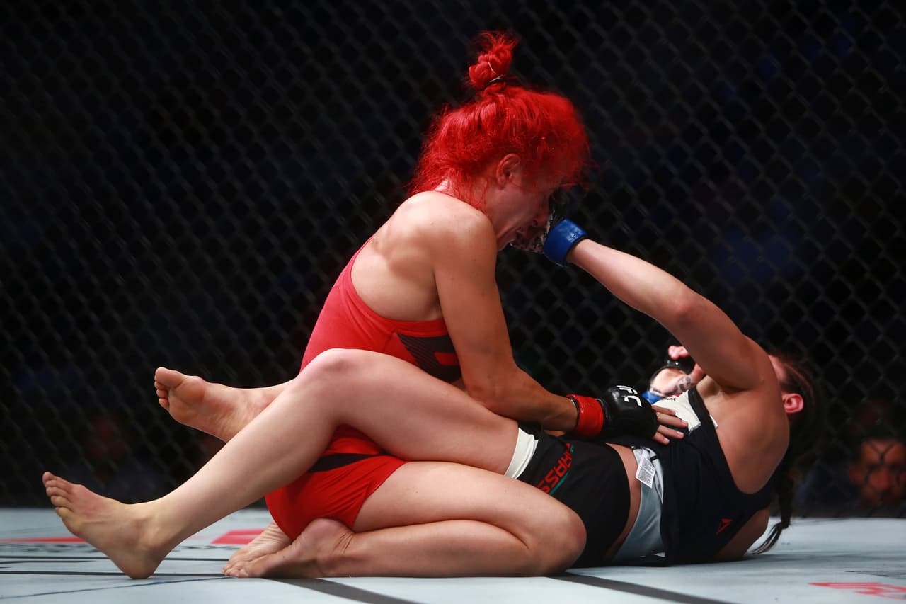 MEXICO CITY, MEXICO - AUGUST 05: Alexa Grasso of Mexico punches Randa Markos of Canada during the UFC Fight Night Mexico City at Arena Ciudad de Mexico on August 05, 2017 in Mexico City, Mexico. (Photo by Hector Vivas/Getty Images)