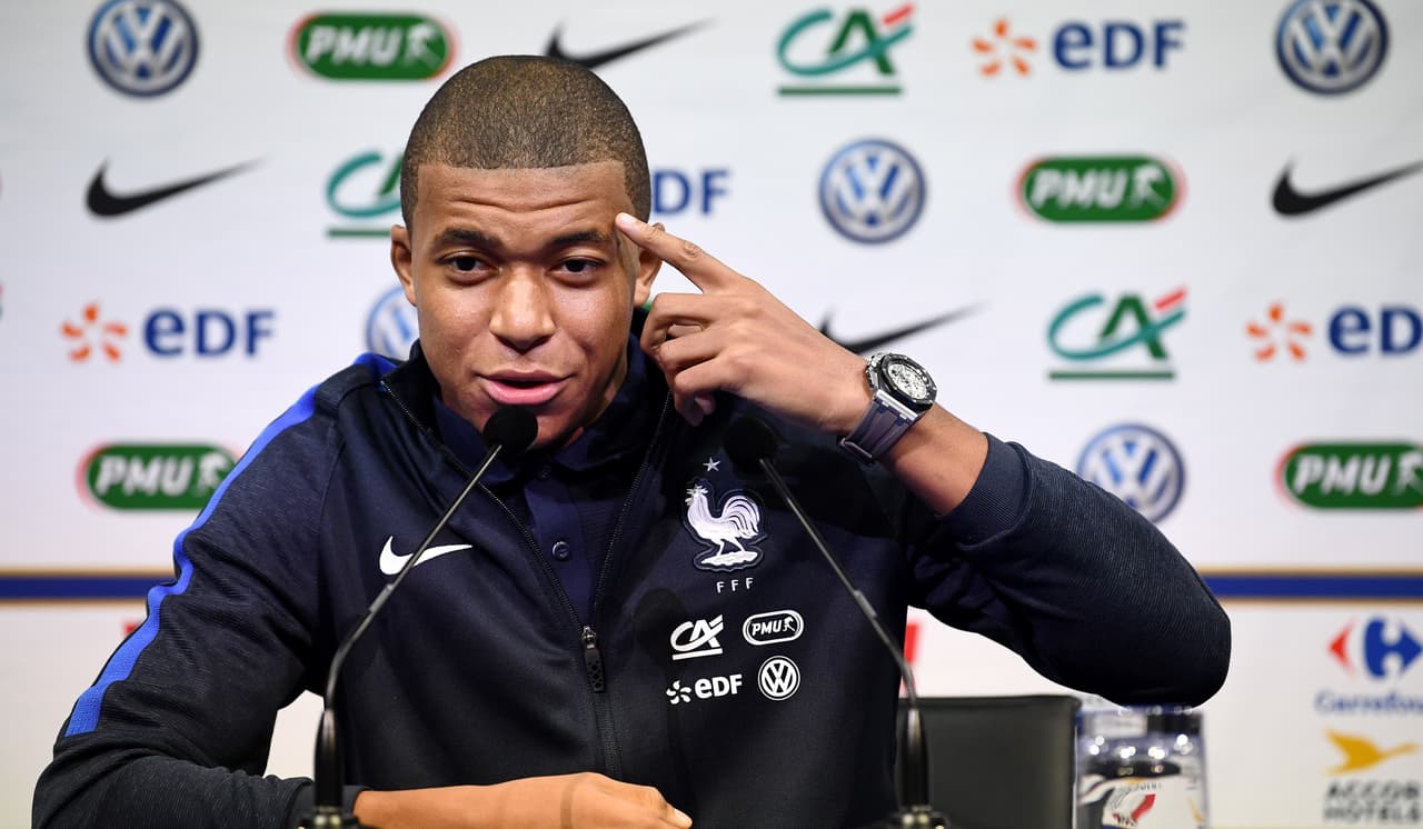 France's forward Kylian Mbappe gestures as he speaks during a press conference in Clairefontaine-en-Yvelines on October 5, 2017, as part of the team's preparation for the FIFA World Cup 2018 qualifying football match against Bulgaria and Belarus. / AFP PHOTO / FRANCK FIFE (Photo credit should read FRANCK FIFE/AFP/Getty Images)