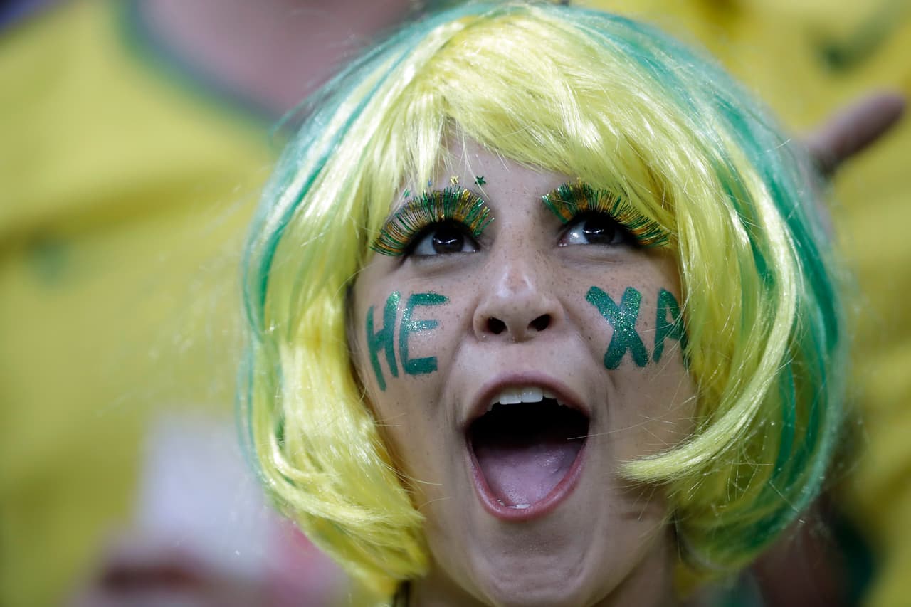 A soccer fan cheers ahead of the group E match between Brazil and Switzerland at the 2018 soccer World Cup in the Rostov Arena in Rostov-on-Don, Russia, Sunday, June 17, 2018. (AP Photo/Felipe Dana)