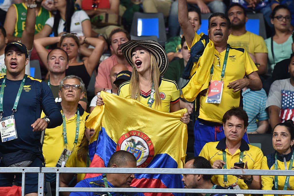 Colombia's fans cheer during a boxing match at the Rio 2016 Olympic Games in Rio de Janeiro on August 17, 2016. / AFP / YURI CORTEZ (Photo credit should read YURI CORTEZ/AFP/Getty Images)
