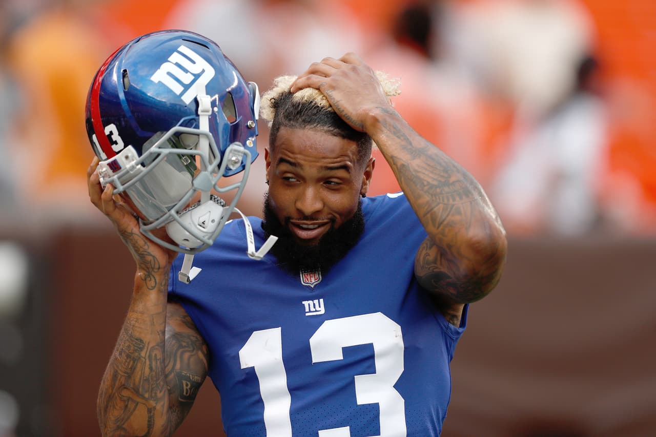 New York Giants wide receiver Odell Beckham Jr. (13) looks on as he puts in his helmet during an NFL football game against the Cleveland Browns, Monday, Aug. 21, 2017, in Cleveland. The Browns won 10-6. (Scott Boehm via AP)