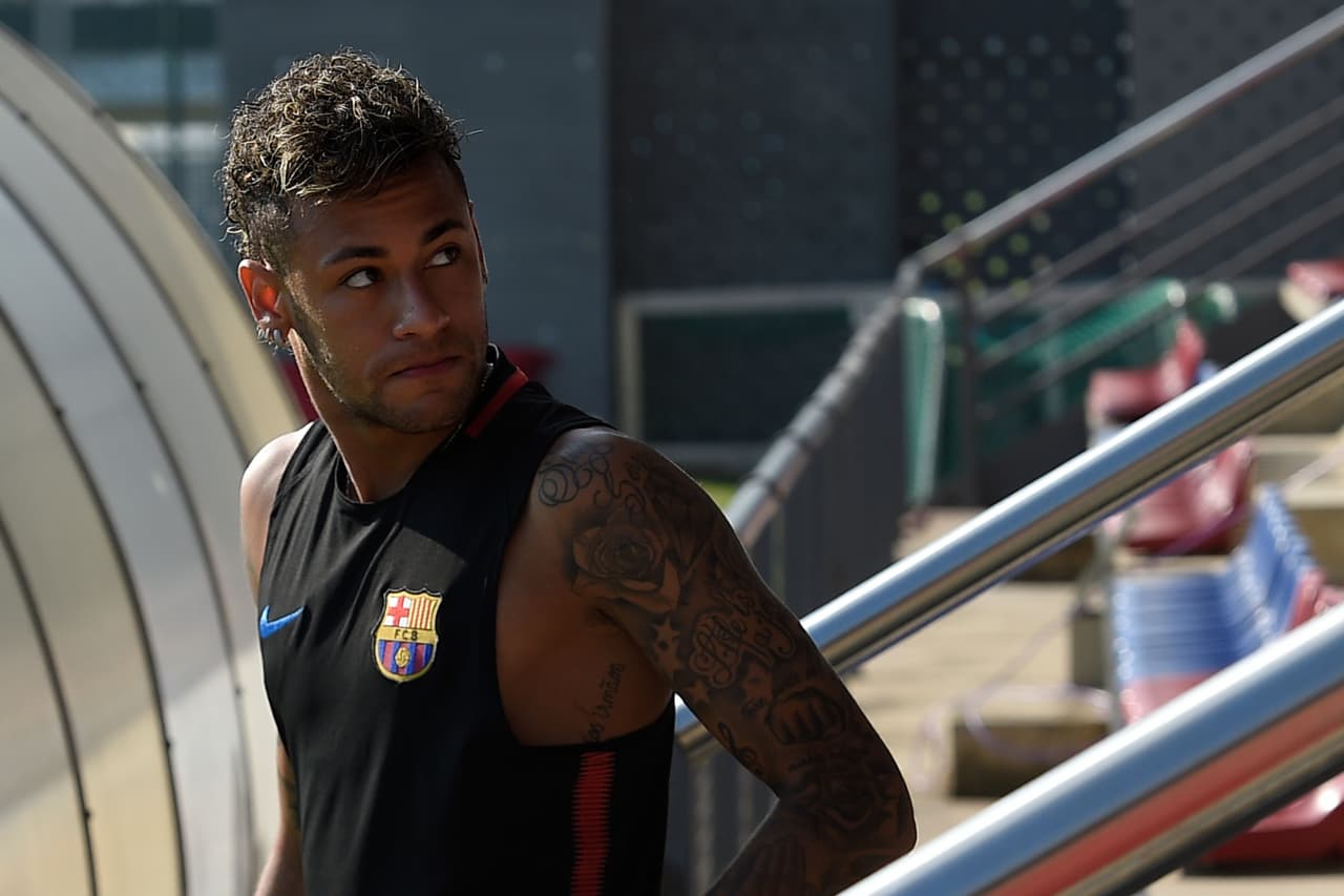 Barcelona's Brazilian forward Neymar arrives for a training session at the Sports Center FC Barcelona Joan Gamper in Sant Joan Despi, near Barcelona on July 17, 2017. / AFP PHOTO / LLUIS GENE (Photo credit should read LLUIS GENE/AFP/Getty Images)