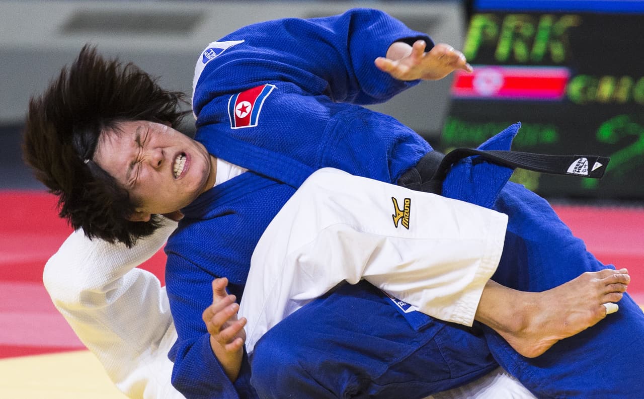 Japan's Kaori Matsumoto (white) competes with Choe Hyon A of Democratic Peoples Republic of Korea during the womens qualification match, in the -57kg category at the Judo World Championships in Astana on August 26, 2015. AFP PHOTO / JACK GUEZ (Photo credit should read JACK GUEZ/AFP/Getty Images)