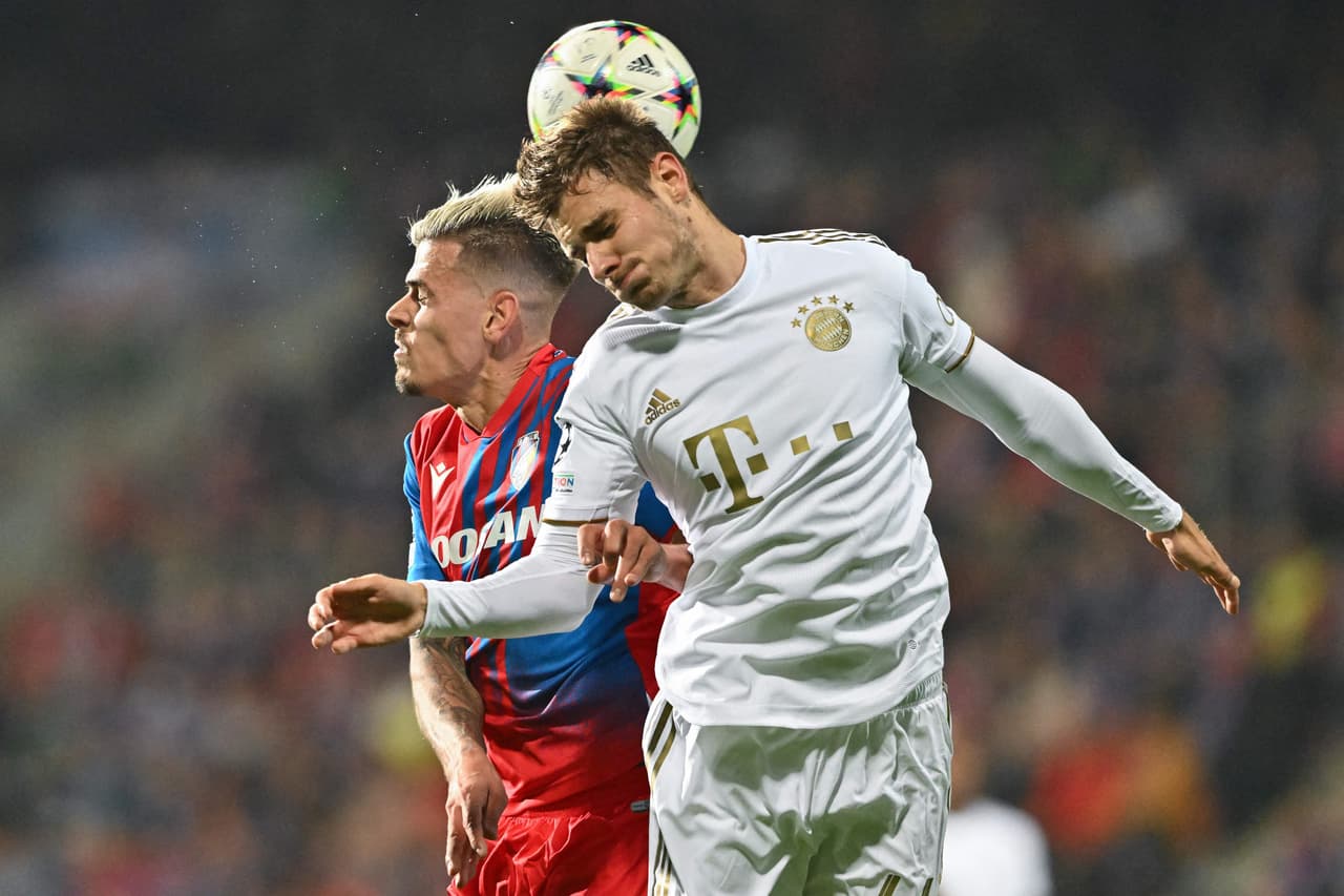 Viktoria Plzen's Czech forward Jan Kliment and Bayern Munich's German defender Josip Stanisic (R) during the UEFA Champions League Group C football match between FC Viktoria Plzen and FC Bayern Munich in Plzen, Czech Republic, on October 12, 2022. (Photo by Joe Klamar / AFP) (Photo by JOE KLAMAR/AFP via Getty Images)