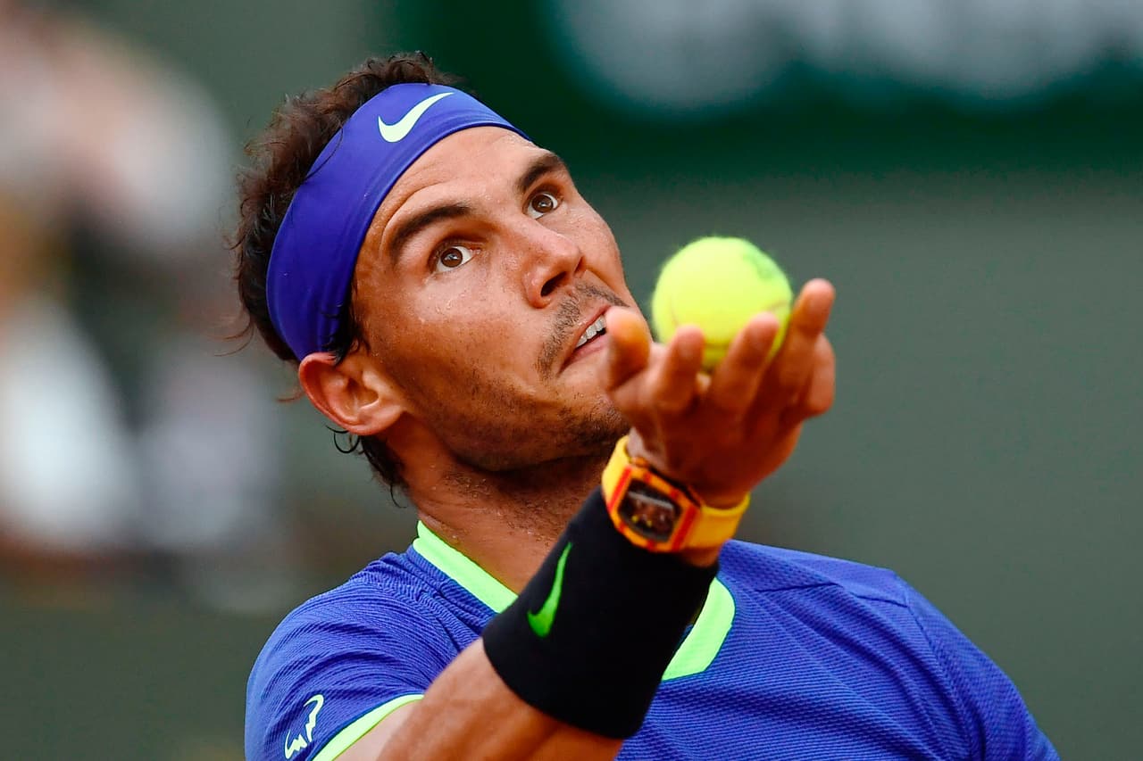 Spain's Rafael Nadal serves to Georgia's Nikoloz Basilashvili during their tennis match at the Roland Garros 2017 French Open on June 2, 2017 in Paris. / AFP PHOTO / CHRISTOPHE SIMON (Photo credit should read CHRISTOPHE SIMON/AFP/Getty Images)