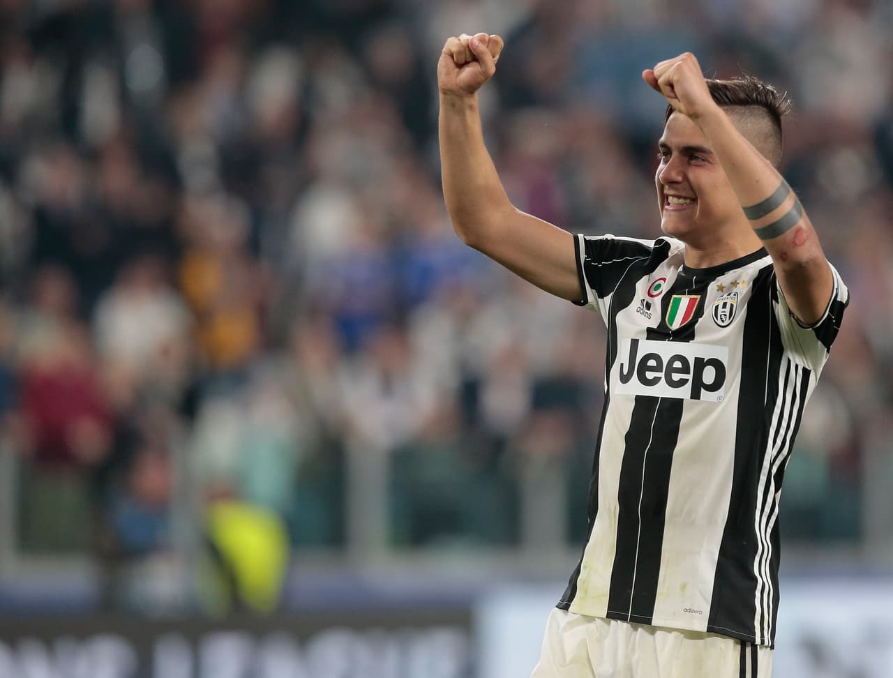TURIN, ITALY - APRIL 11: Paulo Dybala of Juventus FC celebrates at the end of the UEFA Champions League Quarter Final first leg match between Juventus and FC Barcelona at Juventus Stadium on April 11, 2017 in Turin, Italy. (Photo by Emilio Andreoli/Getty Images)
