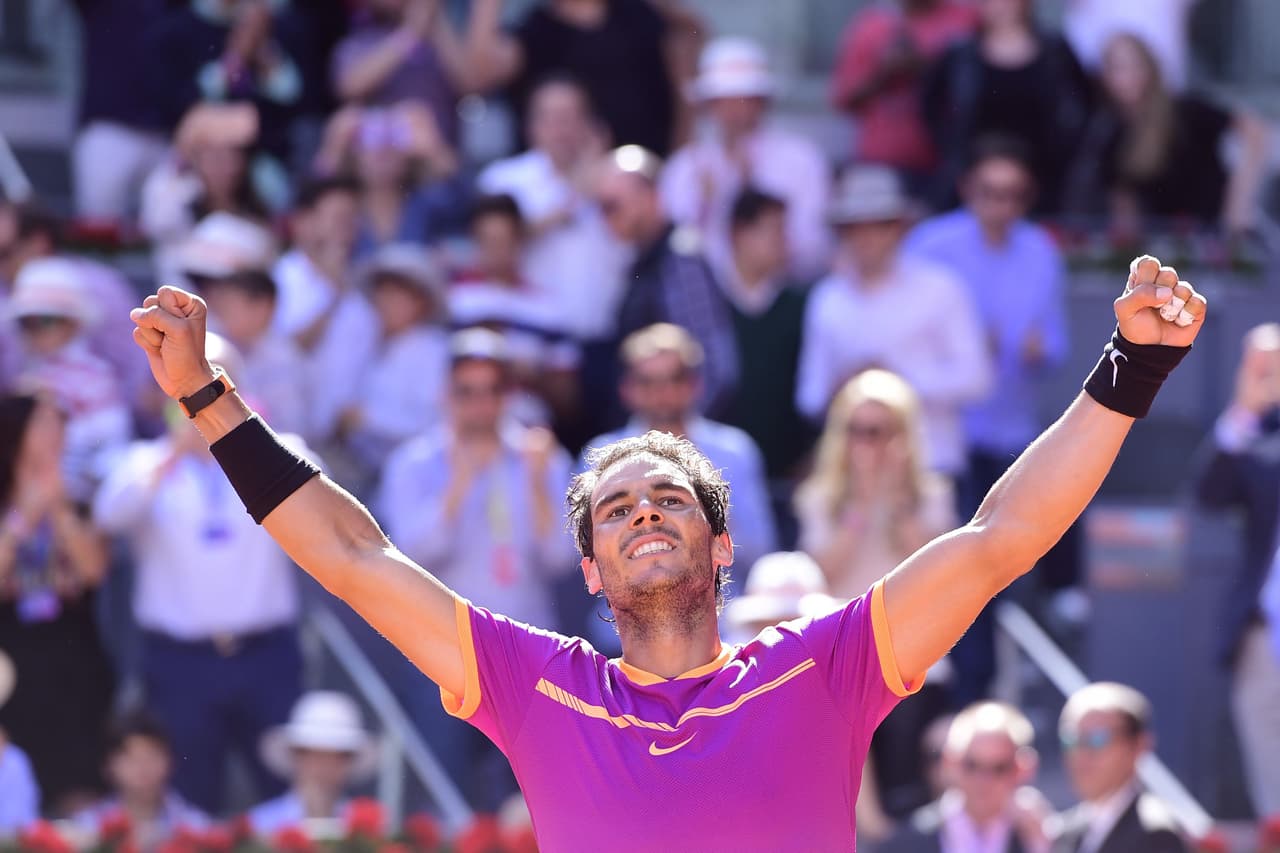 Spanish tennis player Rafael Nadal celebrates his victory over Serbian tennis player Novak Djokovic during their ATP Madrid Open semifinal match in Madrid, on May 13, 2017. Nadal won 6-2 and 6-4. / AFP PHOTO / JAVIER SORIANO (Photo credit should read JAVIER SORIANO/AFP/Getty Images)