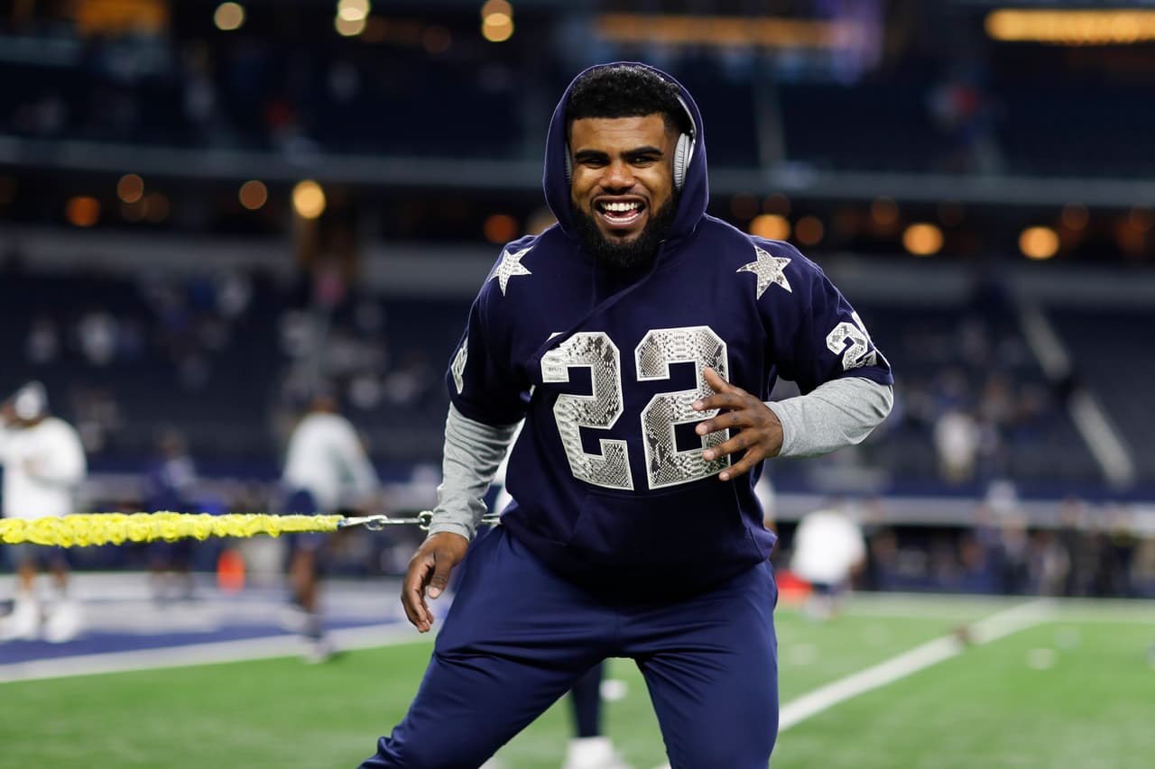 Dallas Cowboys rookie running back Ezekiel Elliott (21) warms up wearing an Emmitt Smith (not pictured) jersey prior to an NFL football game against the Detroit Lions on Monday, Dec. 26, 2016, in Arlington, Texas. Dallas won 42-21. (Aaron M. Sprecher via AP)