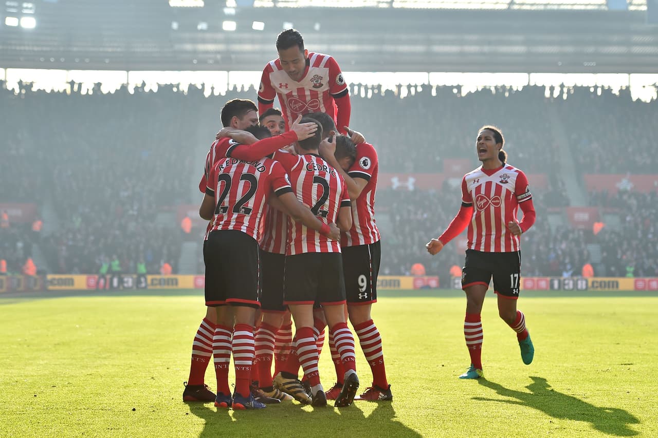 Southampton's English midfielder James Ward-Prowse celebrates with teammates after scoring the opening goal of the English Premier League football match between Southampton and Leicester City at St Mary's Stadium in Southampton, southern England on January 22, 2017. Southampton won the game 3-0. / AFP / Glyn KIRK / RESTRICTED TO EDITORIAL USE. No use with unauthorized audio, video, data, fixture lists, club/league logos or 'live' services. Online in-match use limited to 75 images, no video emulation. No use in betting, games or single club/league/player publications. / (Photo credit should read GLYN KIRK/AFP/Getty Images)