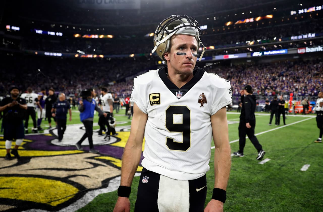 New Orleans Saints quarterback Drew Brees (9) walks off the field after a 29-24 loss to the Minnesota Vikings in an NFL divisional football playoff game in Minneapolis, Sunday, Jan. 14, 2018. The Vikings defeated the Saints 29-24. (AP Photo/Jeff Roberson)