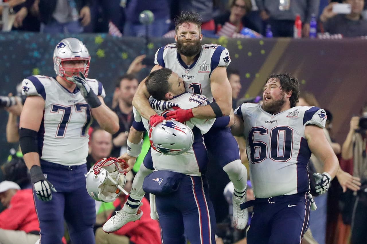HOUSTON, TX - FEBRUARY 05: Tom Brady #12 of the New England Patriots celebrates with Julian Edelman #11 after defeating the Atlanta Falcons 34-28 in overtime to win Super Bowl 51 at NRG Stadium on February 5, 2017 in Houston, Texas. (Photo by Jamie Squire/Getty Images)