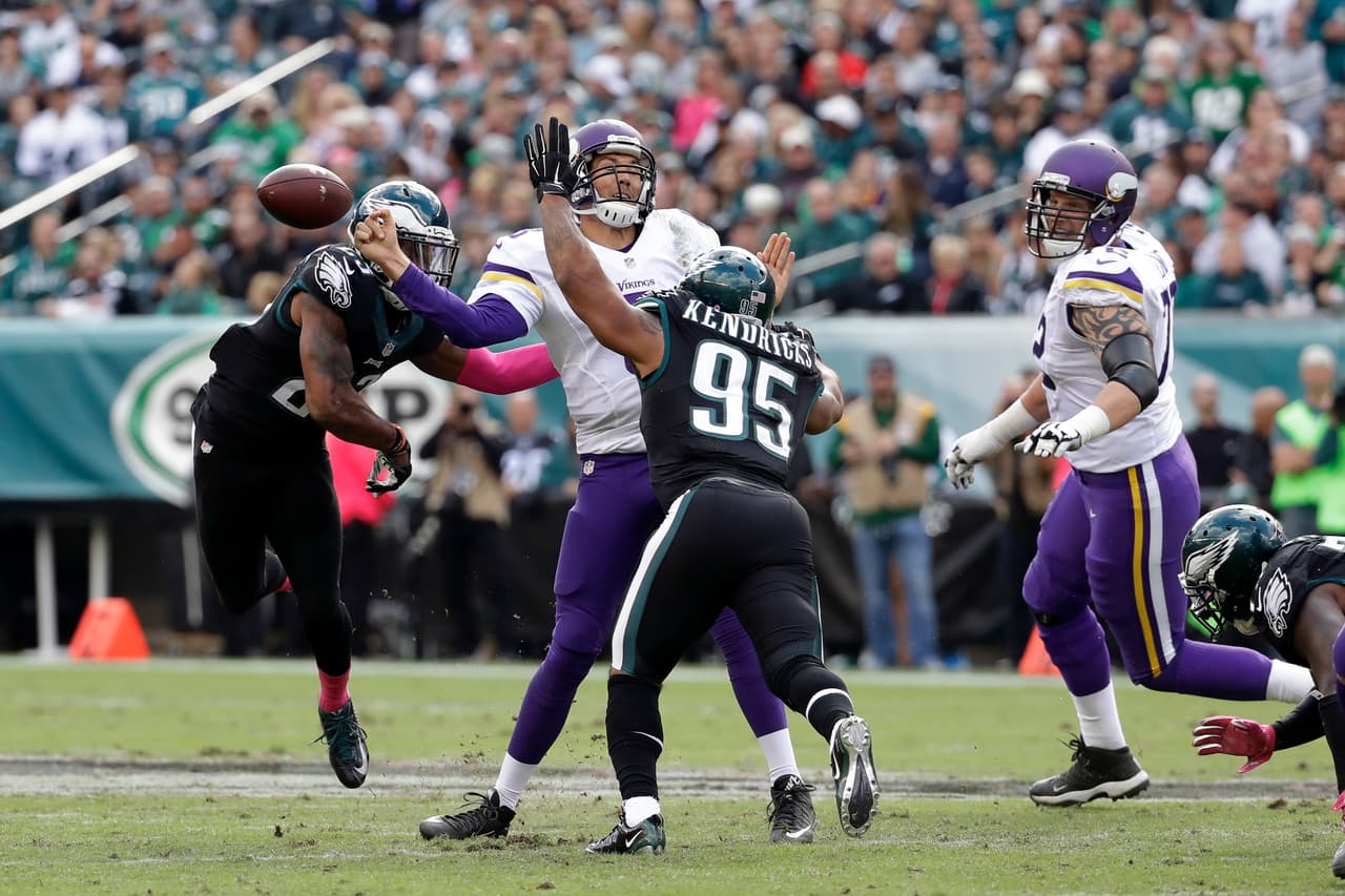 Minnesota Vikings' Sam Bradford, center, fumbles the ball against Philadelphia Eagles' Mychal Kendricks, right, and Rodney McLeod during the first half of an NFL football game, Sunday, Oct. 23, 2016, in Philadelphia. (AP Photo/Chris Szagola)