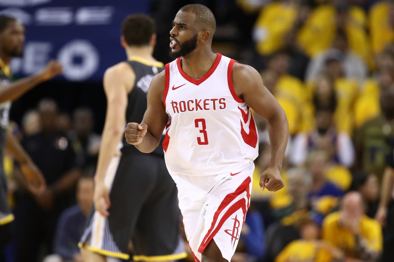 OAKLAND, CA - MAY 22: Chris Paul #3 of the Houston Rockets reacts after a basket against the Golden State Warriors during Game Four of the Western Conference Finals of the 2018 NBA Playoffs at ORACLE Arena on May 22, 2018 in Oakland, California. NOTE TO USER: User expressly acknowledges and agrees that, by downloading and or using this photograph, User is consenting to the terms and conditions of the Getty Images License Agreement. (Photo by Ezra Shaw/Getty Images)