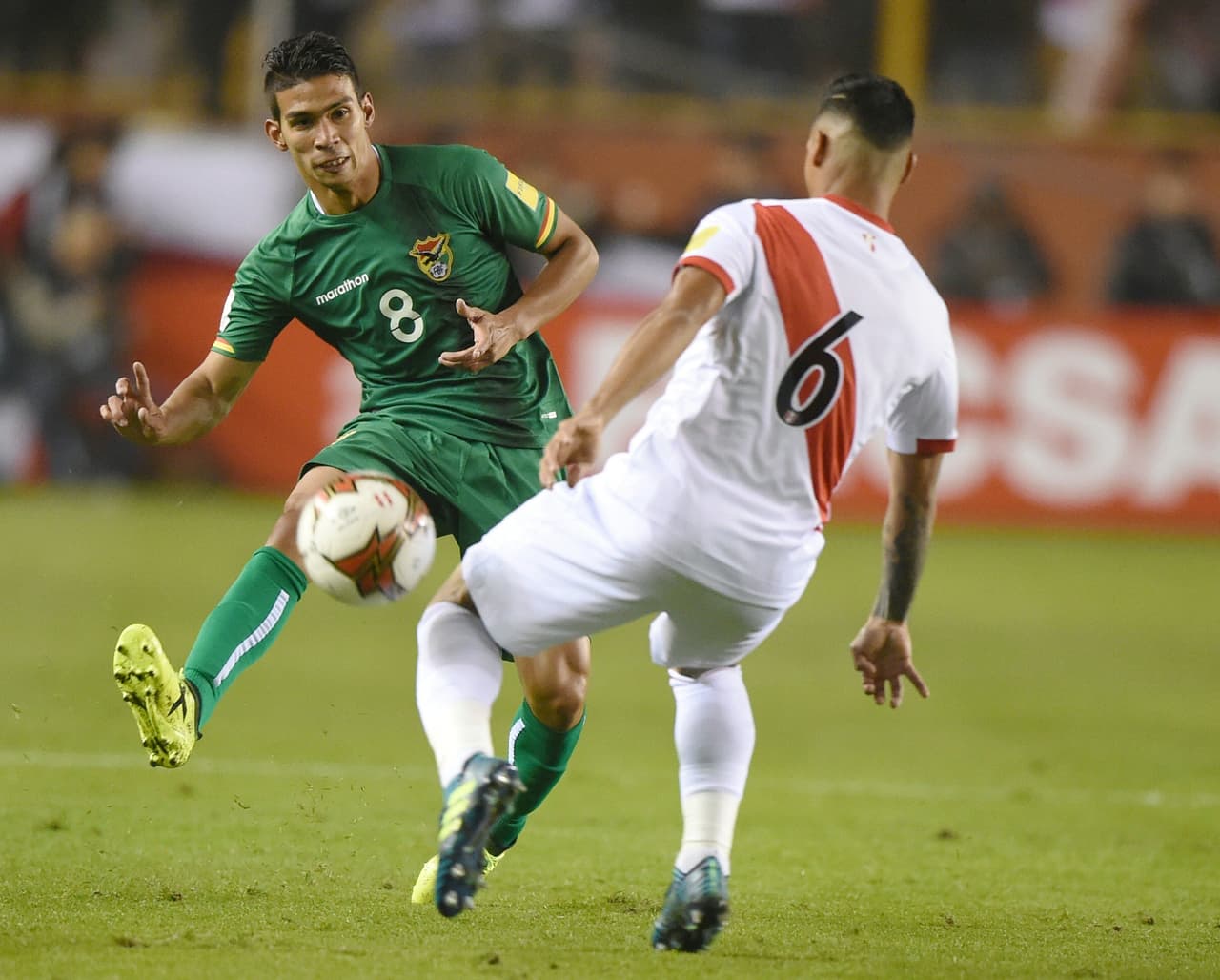 Peru's Miguel Trauco (R) marks Bolivia's Diego Bejarano during their 2018 World Cup qualifier football match in Lima, on August 31, 2017. / AFP PHOTO / Cris BOURONCLE (Photo credit should read CRIS BOURONCLE/AFP/Getty Images)