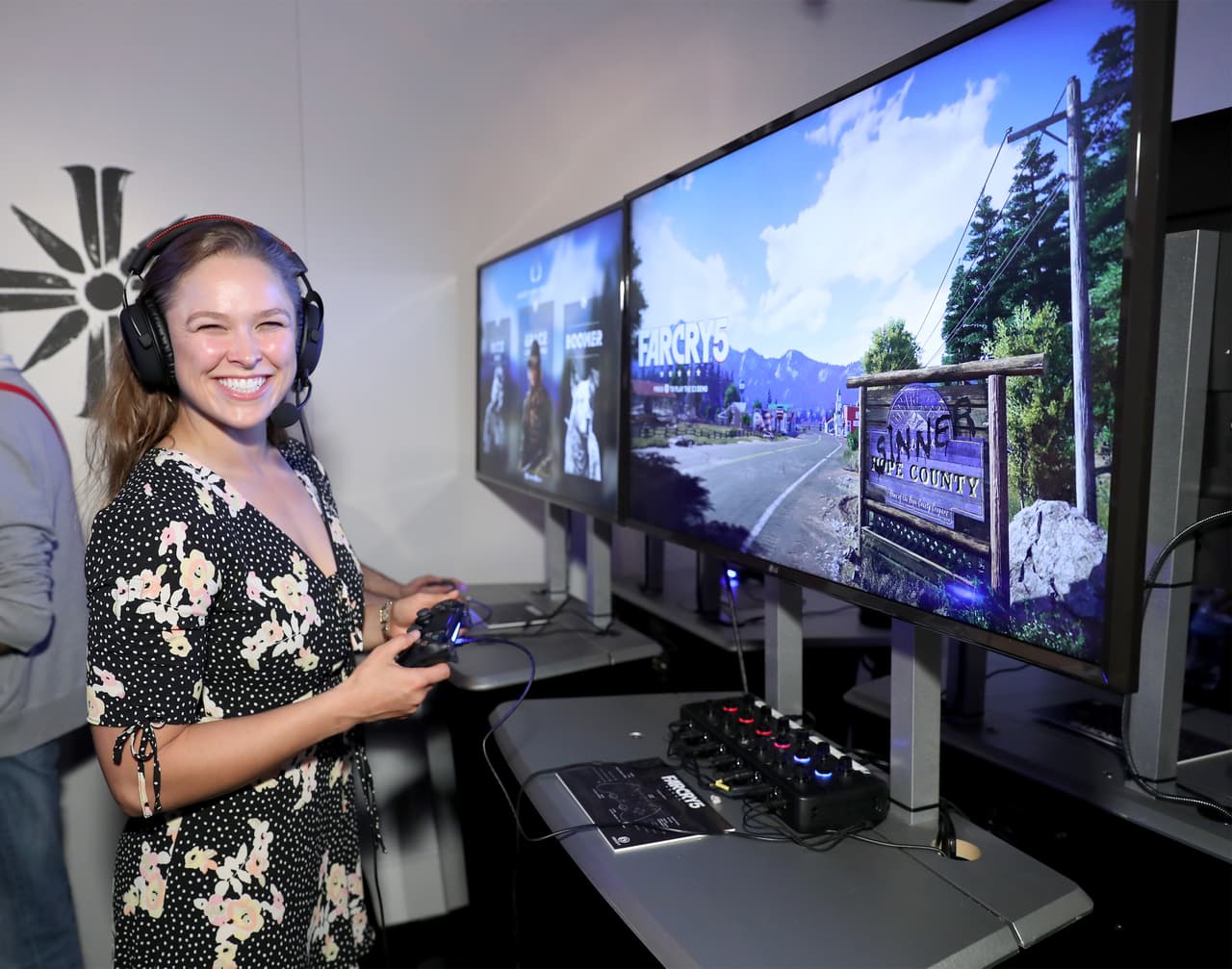 LOS ANGELES, CA - JUNE 14: Ronda Rousey plays Far Cry 5 during E3 2017 at Los Angeles Convention Center on June 14, 2017 in Los Angeles, California. (Photo by Neilson Barnard/Getty Images for Ubisoft)