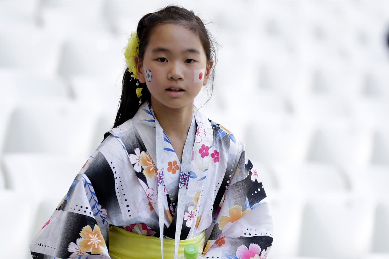 A young Japanese fan waits for the start of the group H match between Japan and Poland at the 2018 soccer World Cup at the Volgograd Arena in Volgograd, Russia, Thursday, June 28, 2018. (AP Photo/Andrew Medichini)