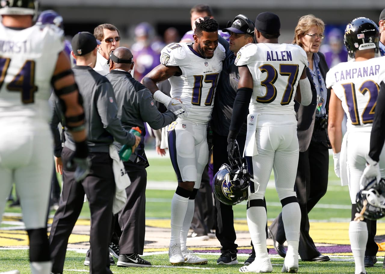 Baltimore Ravens wide receiver Mike Wallace (17) is helped off the field after getting injured during the first half of an NFL football game against the Minnesota Vikings, Sunday, Oct. 22, 2017, in Minneapolis. (AP Photo/Jim Mone)