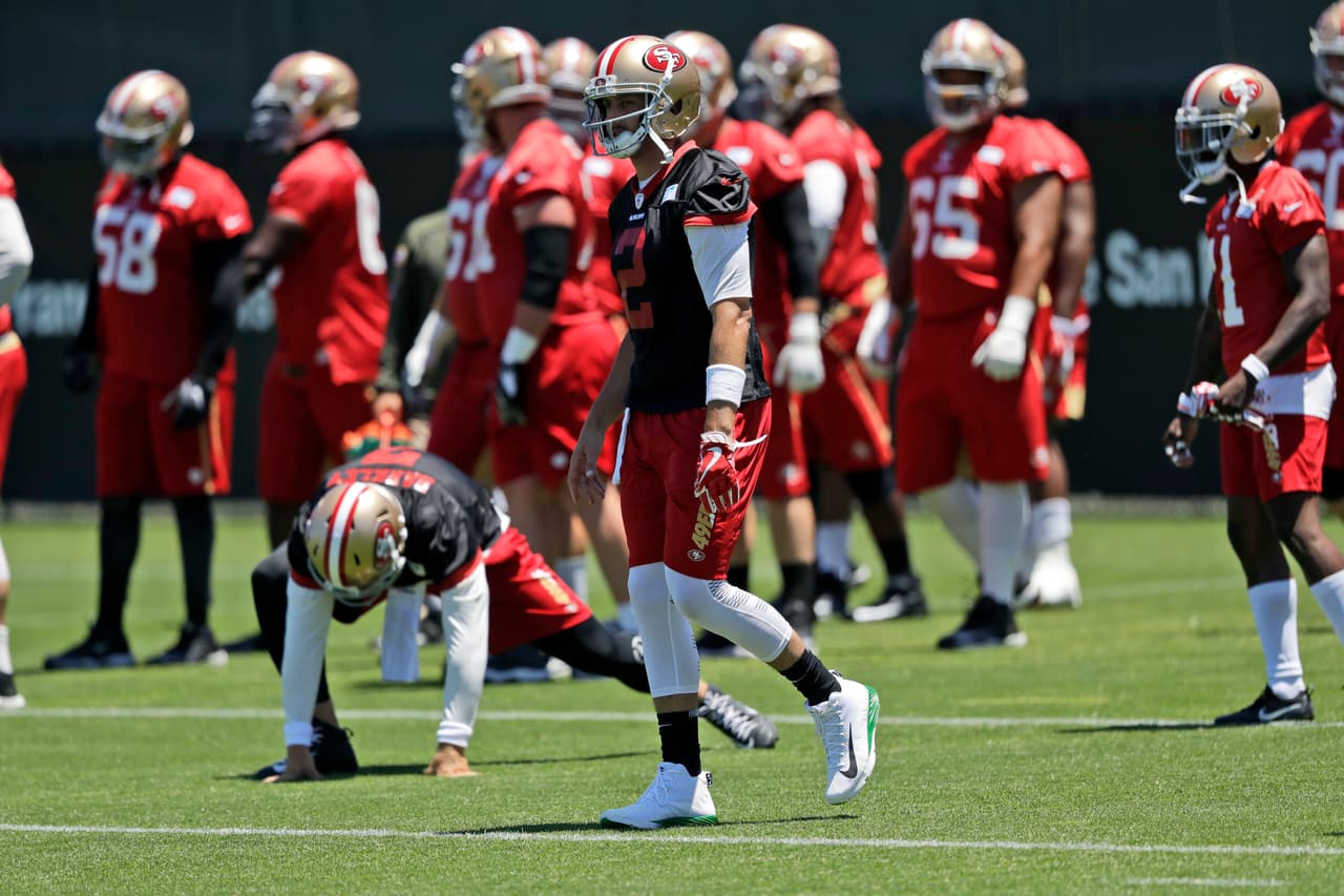 San Francisco 49ers quarterback Brian Hoyer, center, walks with teammates during NFL football practice at the team's training facility Wednesday, June 14, 2017, in Santa Clara, Calif. (AP Photo/Marcio Jose Sanchez)