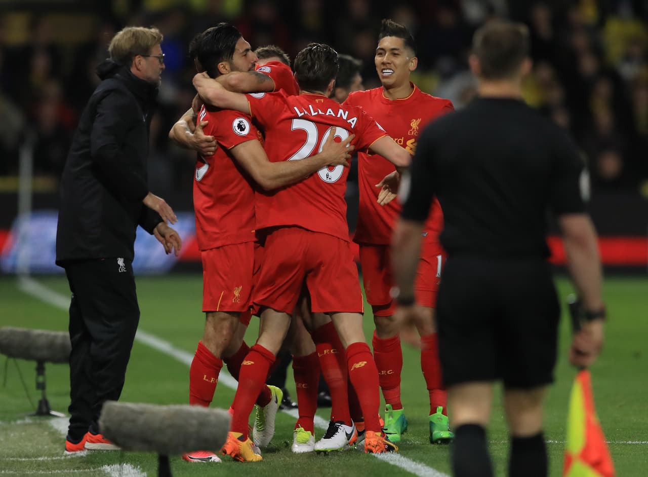 WATFORD, ENGLAND - MAY 01: Emre Can of Liverpool is congratulated by teammates after scoring the opening goal during the Premier League match between Watford and Liverpool at Vicarage Road on May 1, 2017 in Watford, England. (Photo by Richard Heathcote/Getty Images)