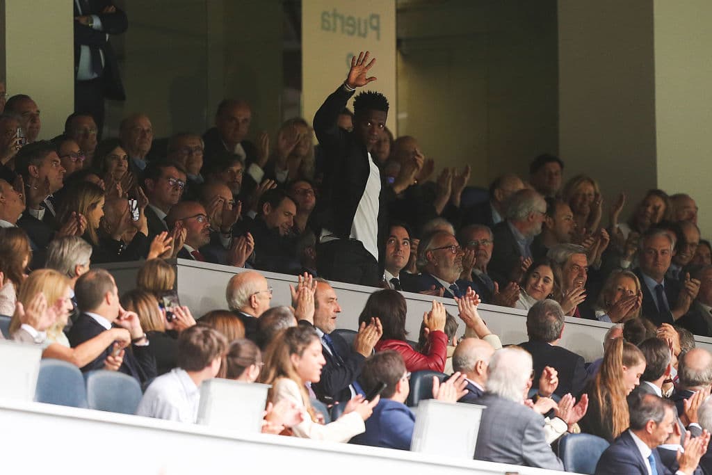 MADRID, SPAIN - MAY 24: Spectators applaud Vinicius Junior of Real Madrid in the stands during the LaLiga Santander match between Real Madrid CF and Rayo Vallecano at Estadio Santiago Bernabeu on May 24, 2023 in Madrid, Spain. (Photo by Florencia Tan Jun/Getty Images)
