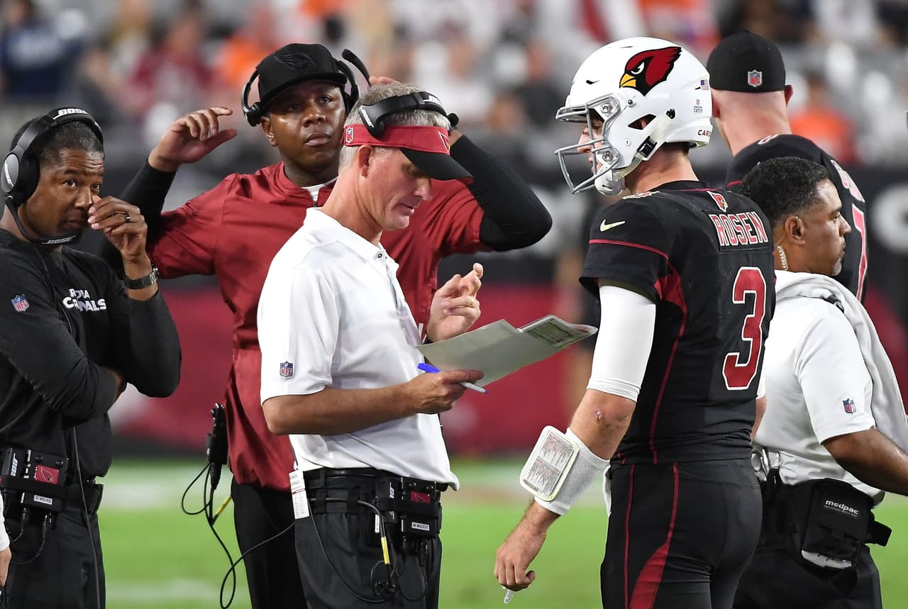 GLENDALE, AZ - OCTOBER 18: Offensive coordinator Mike McCoy (front), quarterbacks coach Byron Leftwich and head coach Steve Wilks talk with quarterback Josh Rosen #3 of the Arizona Cardinals during the second half against the Denver Broncos at State Farm Stadium on October 18, 2018 in Glendale, Arizona. (Photo by Norm Hall/Getty Images)