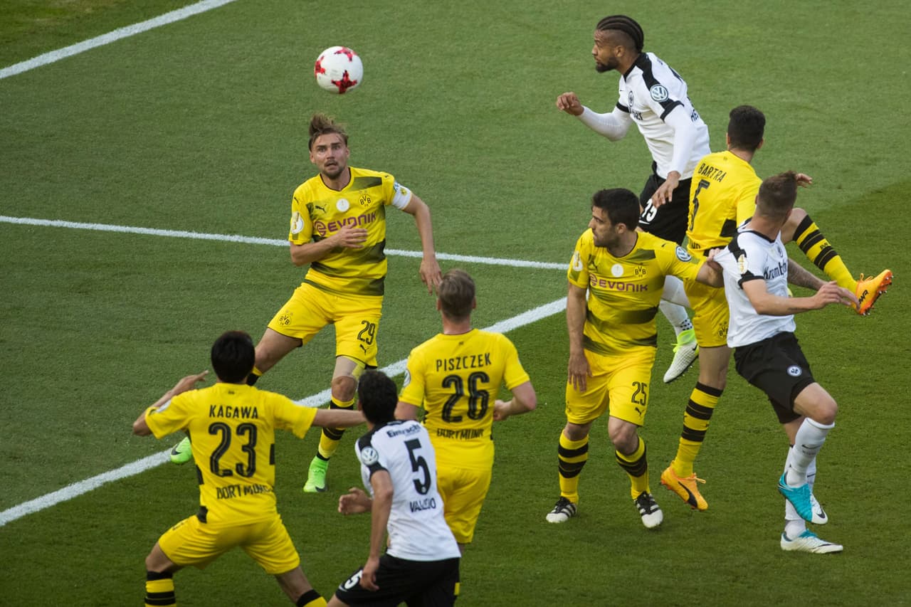 Frankfurt's Jamaican defender Michael Hector heads the ball during the German Cup (DFB Pokal) final football match Eintracht Frankfurt v BVB Borussia Dortmund at the Olympic stadium in Berlin on May 27, 2017. / AFP PHOTO / Odd ANDERSEN / RESTRICTIONS: ACCORDING TO DFB RULES IMAGE SEQUENCES TO SIMULATE VIDEO IS NOT ALLOWED DURING MATCH TIME. MOBILE (MMS) USE IS NOT ALLOWED DURING AND FOR FURTHER TWO HOURS AFTER THE MATCH. == RESTRICTED TO EDITORIAL USE == FOR MORE INFORMATION CONTACT DFB DIRECTLY AT +49 69 67880 / (Photo credit should read ODD ANDERSEN/AFP/Getty Images)