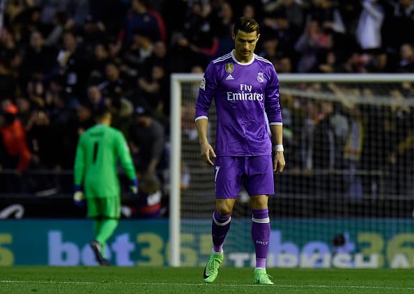 Real Madrid's Portuguese forward Cristiano Ronaldo stands after a goal by Valencia during the Spanish league football match Valencia CF vs Real Madrid CF at the Mestalla stadium in Valencia on February 22, 2017. / AFP / JOSE JORDAN (Photo credit should read JOSE JORDAN/AFP/Getty Images)