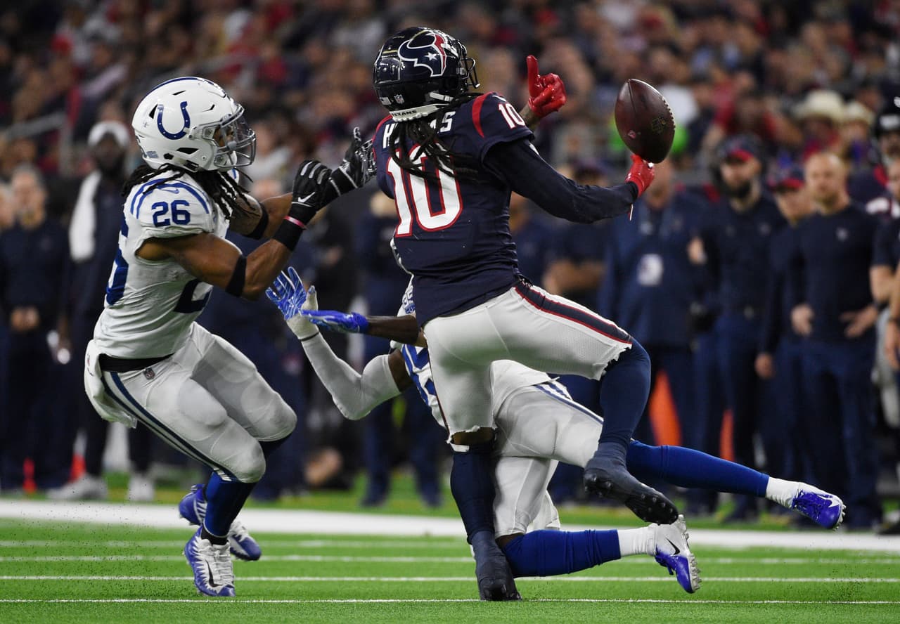 Indianapolis Colts cornerback Pierre Desir (35) and strong safety Clayton Geathers (26) break up a pass intended for Houston Texans wide receiver DeAndre Hopkins (10) during the second half of an NFL wild card playoff football game, Saturday, Jan. 5, 2019, in Houston. (AP Photo/Eric Christian Smith)