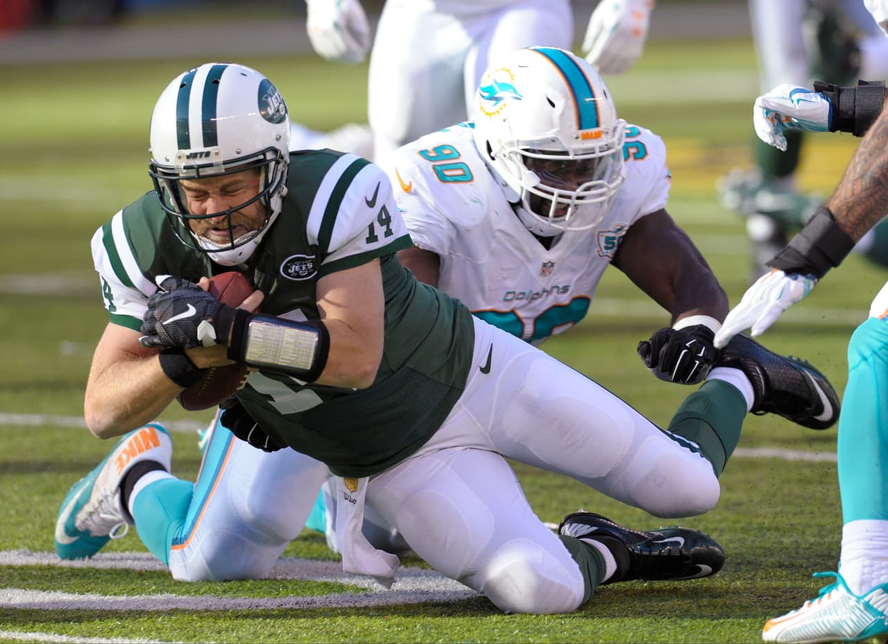 Los Jets continúan en la lucha por el comodín en la AFC al derrotar 38-20 a los Dolphins, checa las mejores tomas del partido.